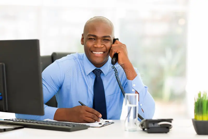 Professional woman in hijab standing confidently in an office